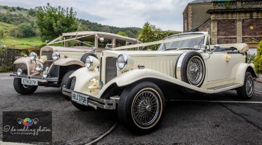 Vintage Cream Wedding Cars in the Courtyard at Craig y Nos Castle