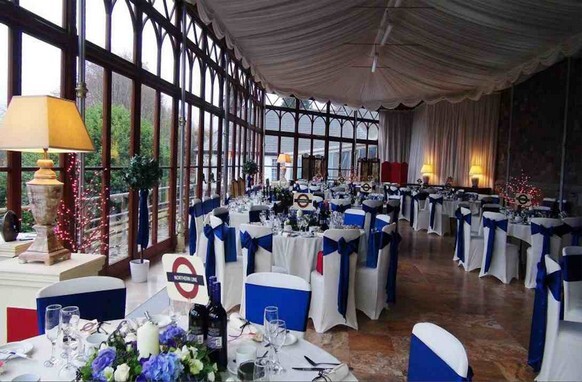 Blue ribbons Craig y Nos Castle Conservatory with London underground table names
