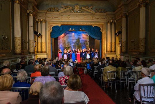 Shows the opera House in use for a Summer operatic Concert