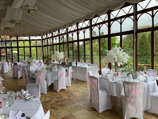 Craig y Nos Castle Wedding Venue Swansea Conservatory with light purple chair covers