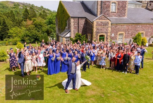 Wedding Guests in theatre gardens at Craig y Nos Castle Wales Wedding Venue