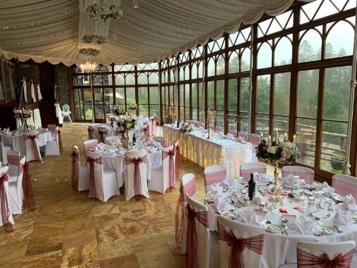 Craig y Nos Castle Wedding Banquet tables pink bows