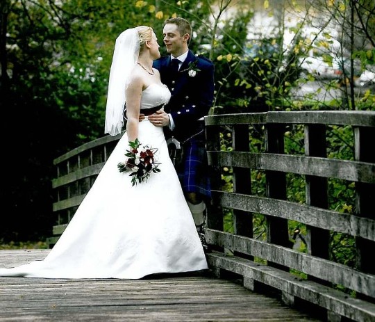 Wedding Planner Guide, Couple in Craig y Nos Country Park on bridge