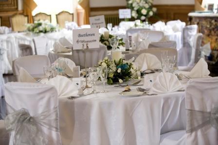 Craig y Nos Castle in South Wales Wedding Breakfast table setting white table cloths and white napkins