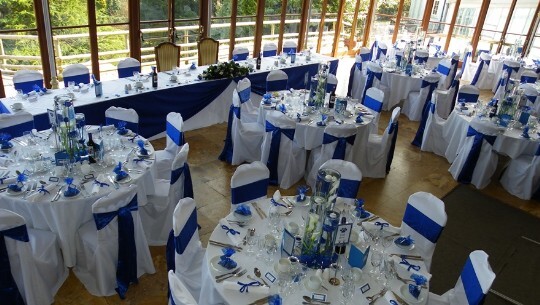 Craig y Nos Castle Wedding Venue with deep Blue ribbons on crisp white chair covers