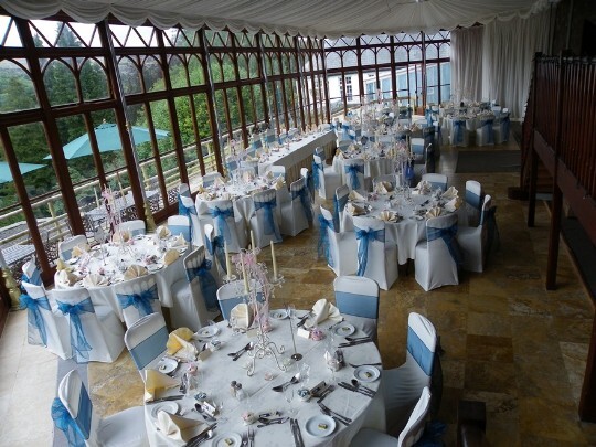 Craig y Nos Castle Wedding Venue Swansea Conservatory laid up in blue and white for a Wedding Breakfast