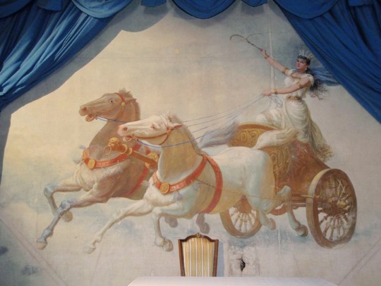 The theatre curtain at Craig y Nos Castle's theatre in South Wales featuring Adelina Patti riding a chariot