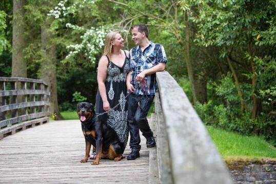 Dog Friendly Wedding Venue Craig y Nos Castle, couple with dog on bridge in Country Park