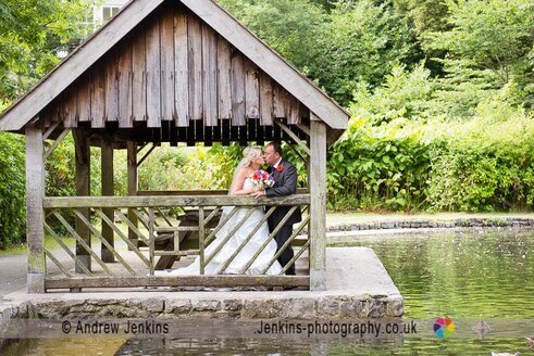 Wedding Couple by the boating lake in Craig y Nos Country Park