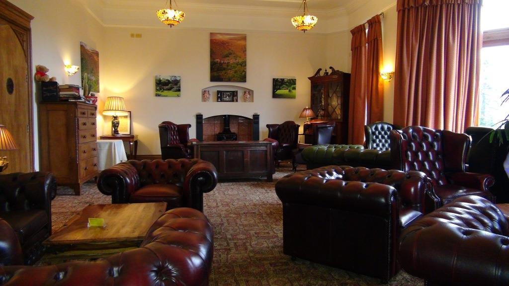 Leather chesterfield sofas and chairs in Craig y Nos Castle's Nicolini Lounge South Wales