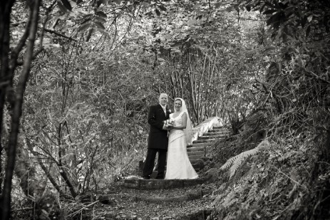 Wedding Photography by Nigel Pullen Photography, Couple on woodland path steps to lower gardens at Craig y Nos Castle