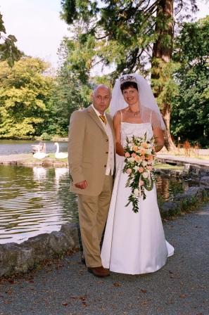 Bride and Groom by lake South Wales Wedding Venue Craig y Nos Castle