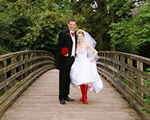 Bridal couple on bridge in Craig y Nos Country Park by Patrick Ellis Wedding Photography