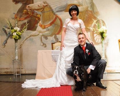 Dog Friendly Wedding Venues - Wedding Ceremony bridal couple with their dog on stage at Craig y Nos Castle - South Wales